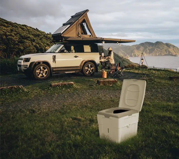 Composting toilet TROBOLO WandaGO Lite outside in fthe nature near a car