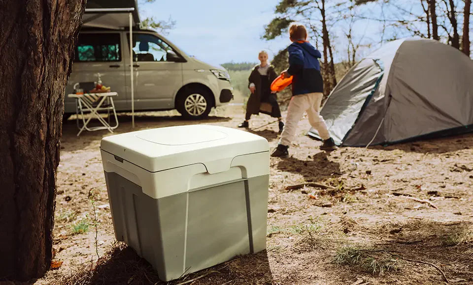 Camper toilet in front of tent