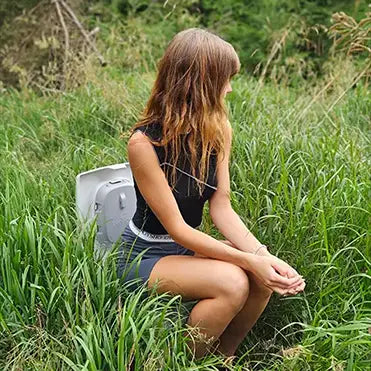 Women on a composting toilet