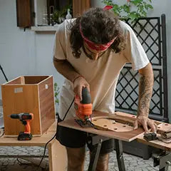 Man building his own DIY toilet